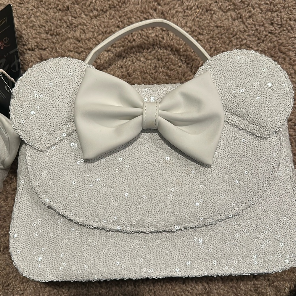 Loungefly Disney sequin bag with exchangeable bow.